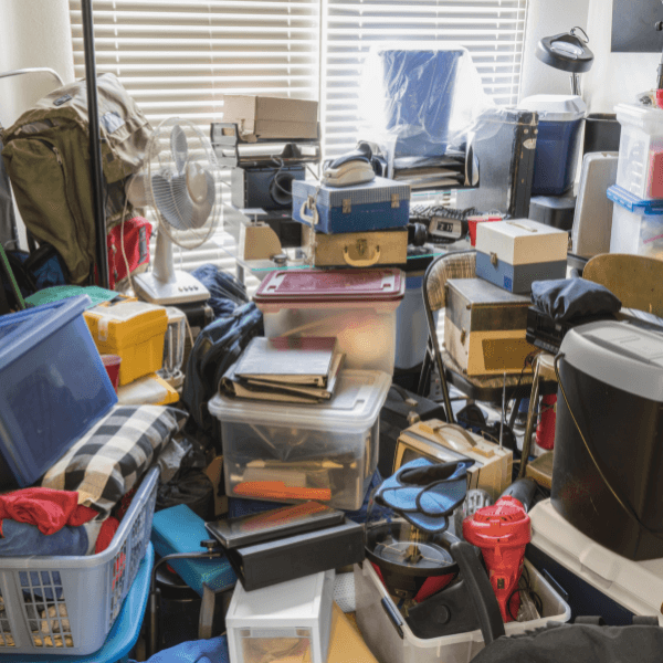 a Vancouver home with a hoarding mess in a bedroom.